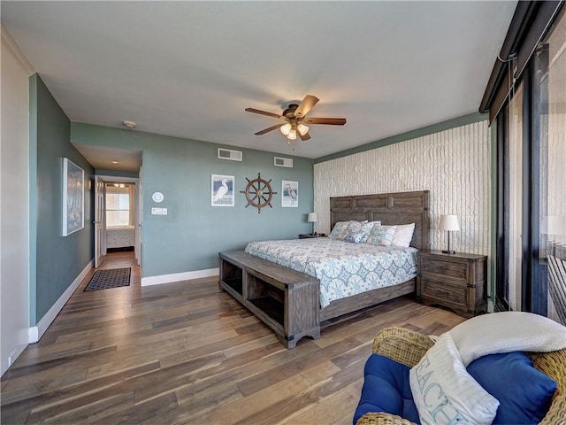 bedroom with ceiling fan and dark wood-type flooring