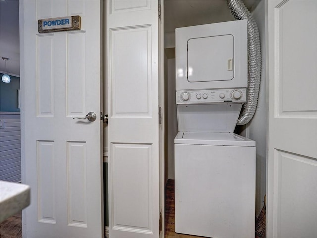 laundry area with stacked washer and clothes dryer