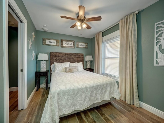 bedroom featuring ceiling fan and hardwood / wood-style flooring