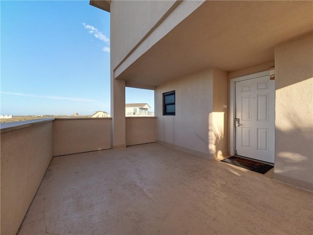 view of patio with a balcony