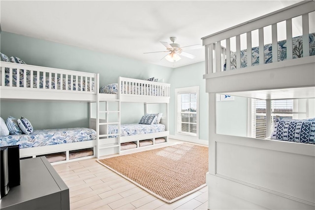 bedroom with ceiling fan and light hardwood / wood-style floors