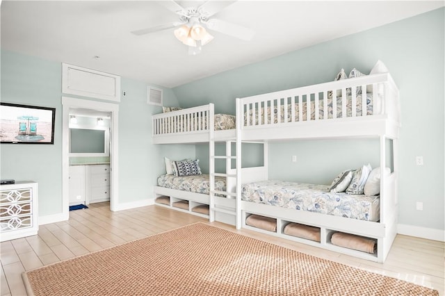 bedroom with ceiling fan and light hardwood / wood-style floors