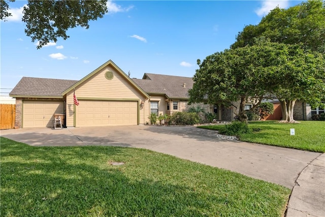 5422 Pressler Dr, Corpus Christi, TX 78413 - view of front of property with a front yard, driveway, fence, and an attached garage