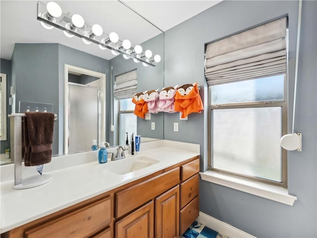 5422 Pressler Dr, Corpus Christi, TX 78413 - bathroom with a shower with door, vanity, and baseboards