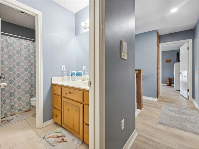 5422 Pressler Dr, Corpus Christi, TX 78413 - full bathroom with a shower with shower curtain, vanity, baseboards, toilet, and visible vents