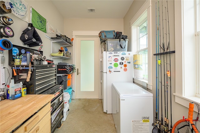 clothes washing area featuring laundry area and visible vents