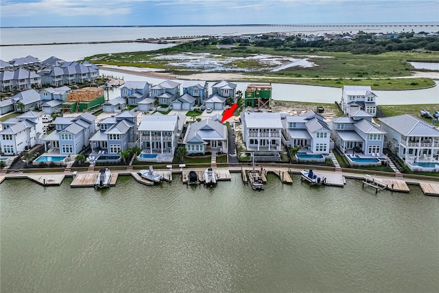 aerial view with a residential view and a water view