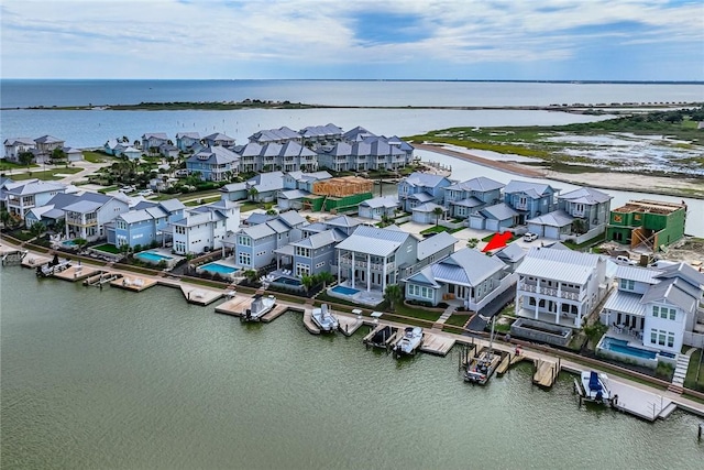 birds eye view of property featuring a residential view and a water view