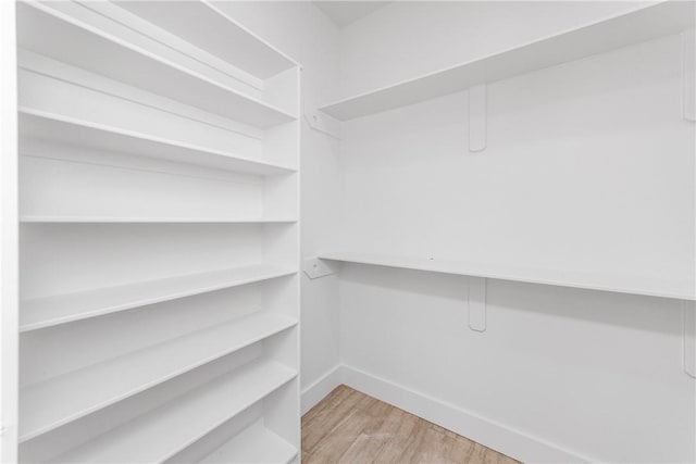 15638 Escapade St, Corpus Christi, TX 78418 - walk in closet featuring wood finished floors