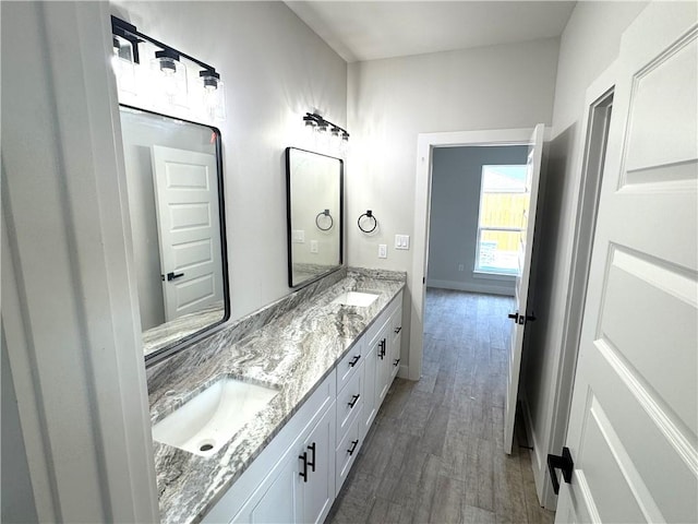 15638 Escapade St, Corpus Christi, TX 78418 - full bathroom featuring double vanity and wood finished floors
