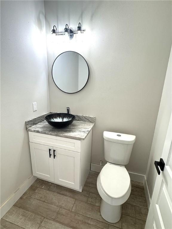 15638 Escapade St, Corpus Christi, TX 78418 - bathroom with vanity and wood finished floors