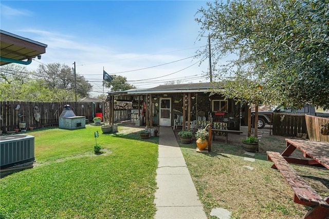 view of yard with cooling unit and a fenced backyard