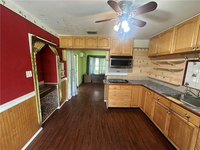 225 W Gile Ave, Aransas Pass, TX 78336 - kitchen featuring ceiling fan, a sink, stainless steel microwave, dark wood-type flooring, and visible vents
