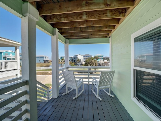 wooden terrace with a residential view