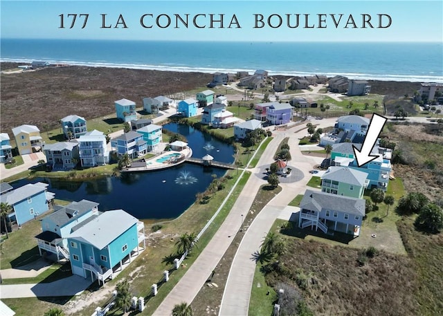 bird's eye view with a water view and a residential view