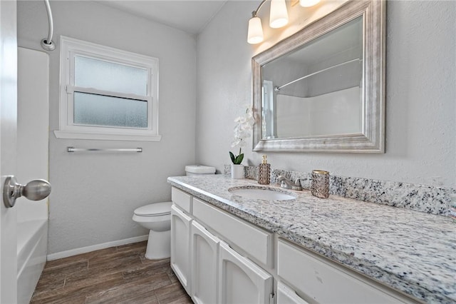 full bathroom featuring vanity, shower / bath combination, and toilet