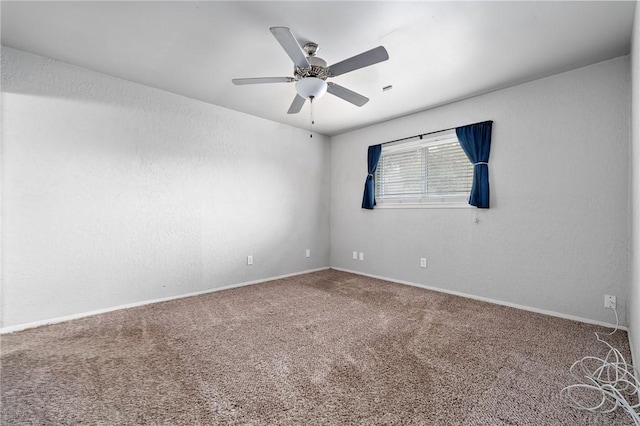 unfurnished room with carpet flooring and ceiling fan