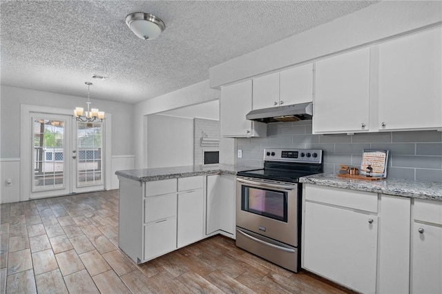 kitchen with kitchen peninsula, french doors, stainless steel electric range oven, white cabinetry, and hanging light fixtures