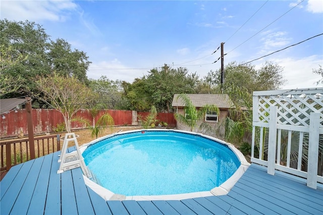 view of swimming pool with a deck