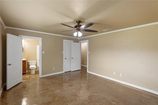 unfurnished bedroom with baseboards, visible vents, concrete floors, and crown molding