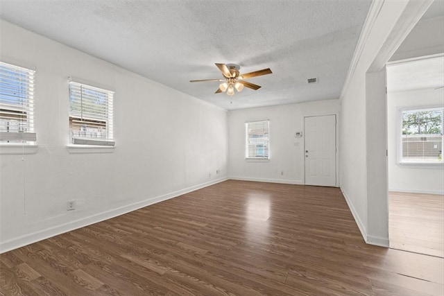 2853 Lawnview St, Corpus Christi, TX 78404 - unfurnished room featuring a textured ceiling, ceiling fan, and wood finished floors