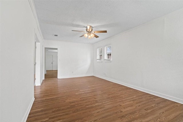2853 Lawnview St, Corpus Christi, TX 78404 - unfurnished room with a ceiling fan, dark wood-style flooring, and a textured ceiling