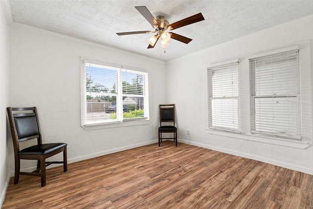 2853 Lawnview St, Corpus Christi, TX 78404 - unfurnished room with wood finished floors, a textured ceiling, and ceiling fan