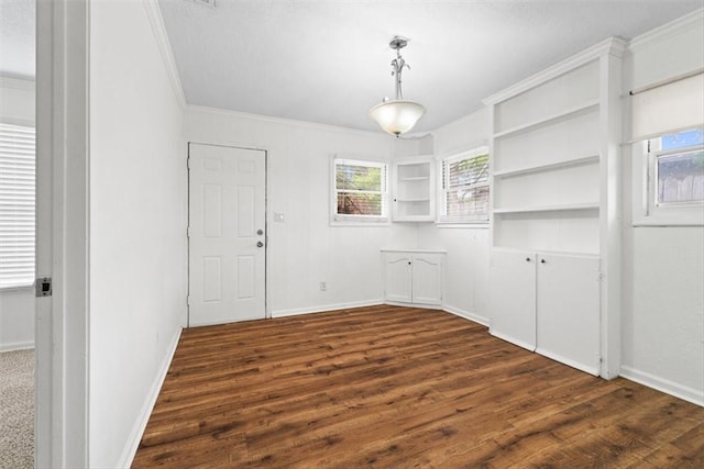 2853 Lawnview St, Corpus Christi, TX 78404 - unfurnished dining area featuring crown molding and dark wood-style flooring