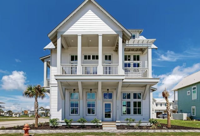 greek revival inspired property featuring a balcony