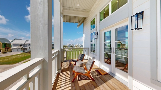 balcony with french doors and a residential view