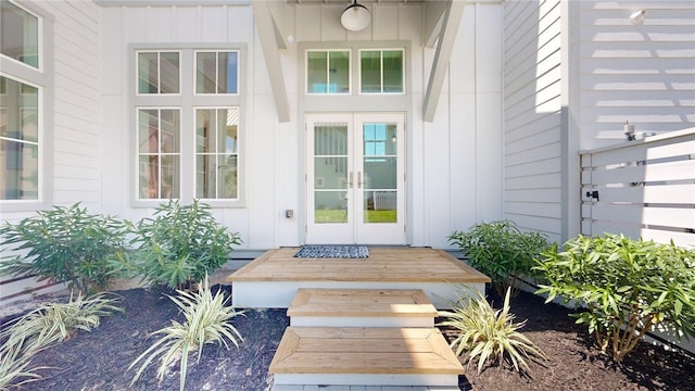 doorway to property with french doors and board and batten siding