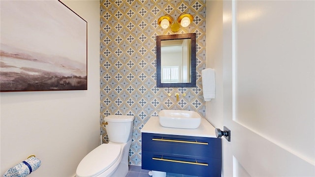 bathroom with toilet and vanity