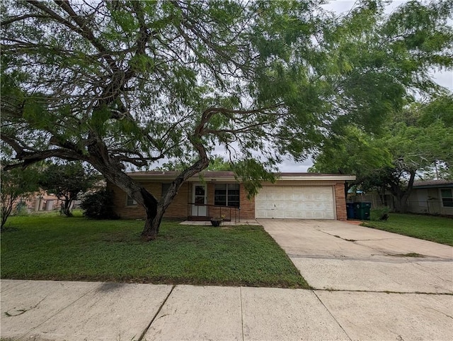 ranch-style house featuring a front lawn and a garage