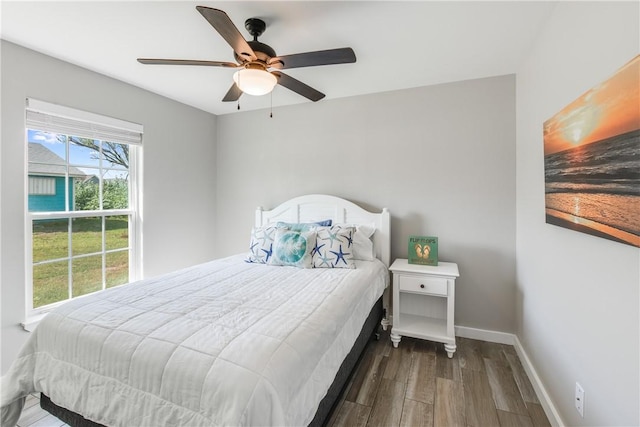 bedroom featuring hardwood / wood-style floors and ceiling fan