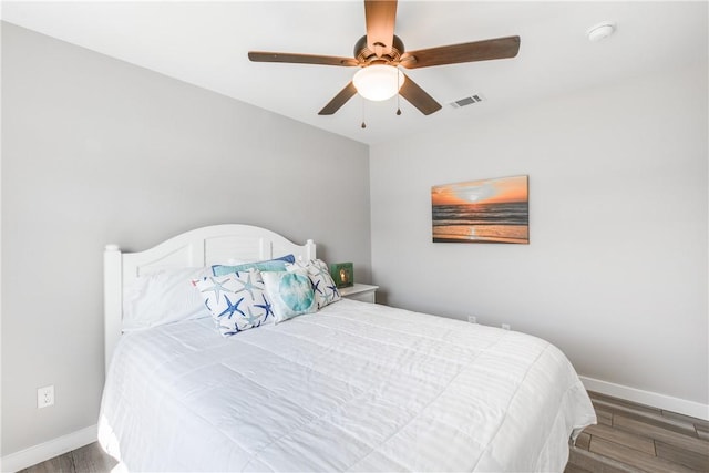 bedroom with hardwood / wood-style floors and ceiling fan