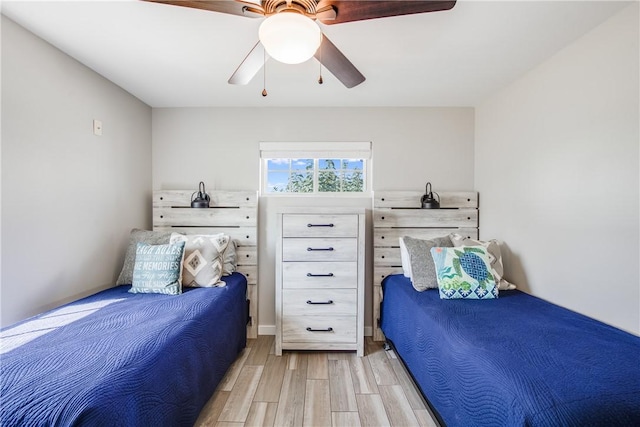 bedroom featuring light hardwood / wood-style floors and ceiling fan