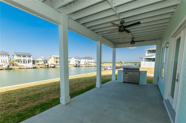 view of patio / terrace with grilling area, a water view, and ceiling fan