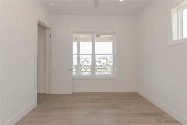 spare room featuring light hardwood / wood-style floors