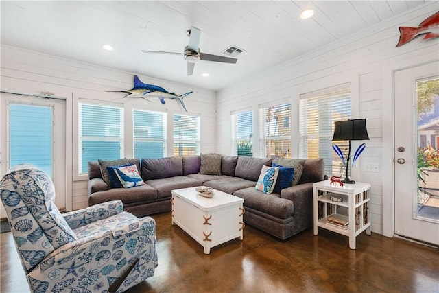 living area with visible vents, recessed lighting, ceiling fan, and finished concrete floors