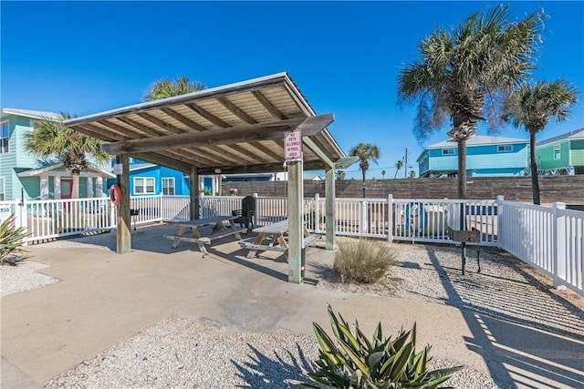 view of patio featuring fence