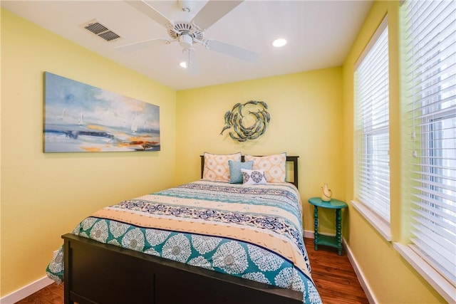 bedroom with visible vents, a ceiling fan, wood finished floors, recessed lighting, and baseboards