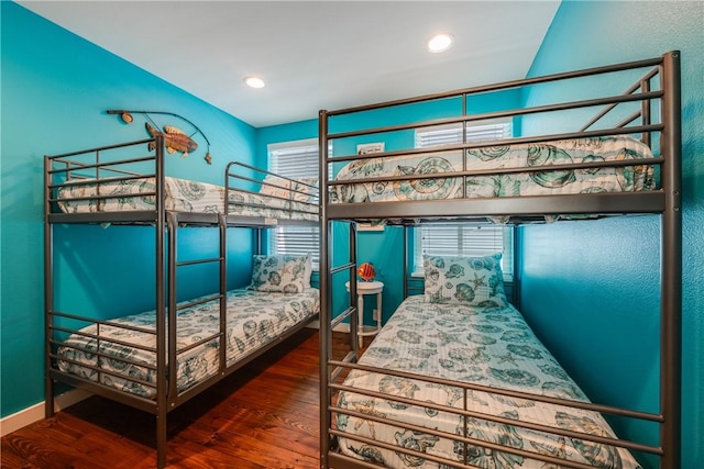 bedroom with recessed lighting, baseboards, and wood finished floors