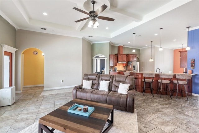 14106 Coquina Bay Ave, Corpus Christi, TX 78418 - living area featuring a ceiling fan, arched walkways, baseboards, recessed lighting, and crown molding