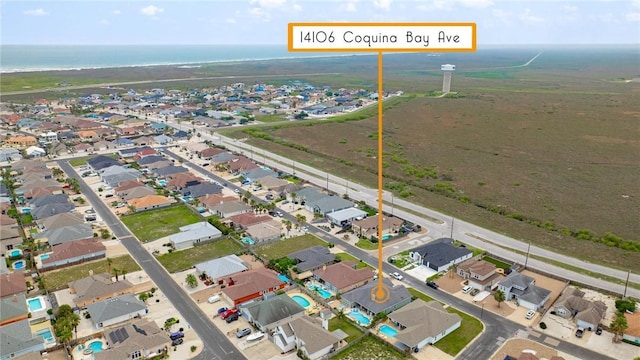 14106 Coquina Bay Ave, Corpus Christi, TX 78418 - aerial overview of property's location featuring nearby suburban area and a large body of water