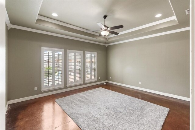 14106 Coquina Bay Ave, Corpus Christi, TX 78418 - spare room featuring a raised ceiling, concrete flooring, ornamental molding, ceiling fan, and baseboards