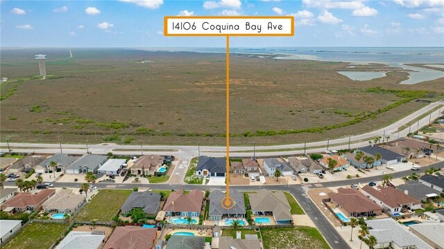 14106 Coquina Bay Ave, Corpus Christi, TX 78418 - aerial view of property and surrounding area with nearby suburban area and a large body of water