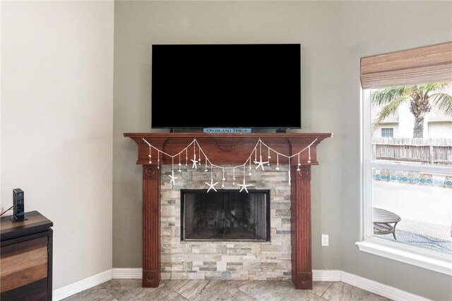 14106 Coquina Bay Ave, Corpus Christi, TX 78418 - detailed view of baseboards and a tiled fireplace
