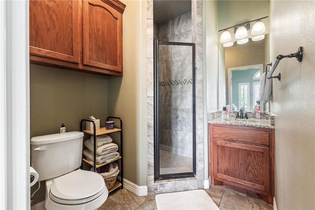14106 Coquina Bay Ave, Corpus Christi, TX 78418 - full bath with vanity, toilet, a shower stall, baseboards, and tile patterned flooring