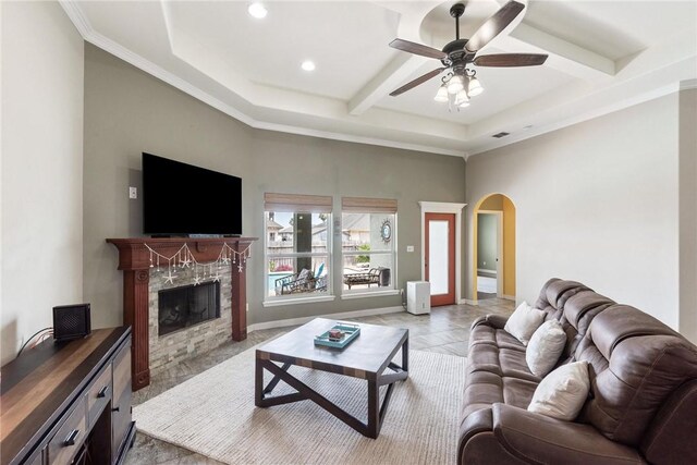 14106 Coquina Bay Ave, Corpus Christi, TX 78418 - living area with arched walkways, ceiling fan, recessed lighting, a fireplace, and beamed ceiling