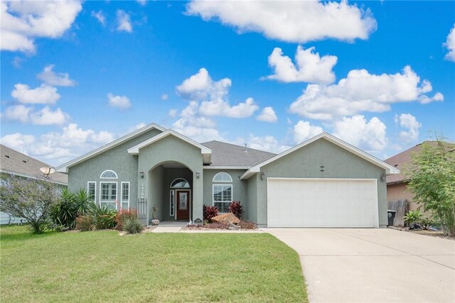 14106 Coquina Bay Ave, Corpus Christi, TX 78418 - ranch-style house with an attached garage, stucco siding, driveway, and a front lawn
